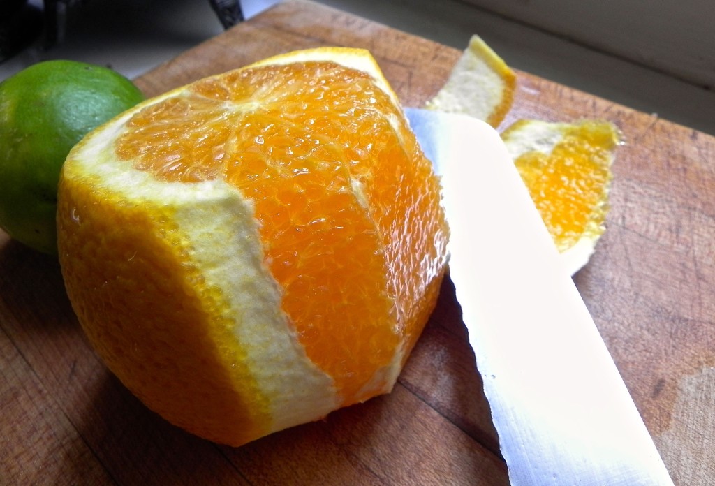 peeling an orange with serrated knife