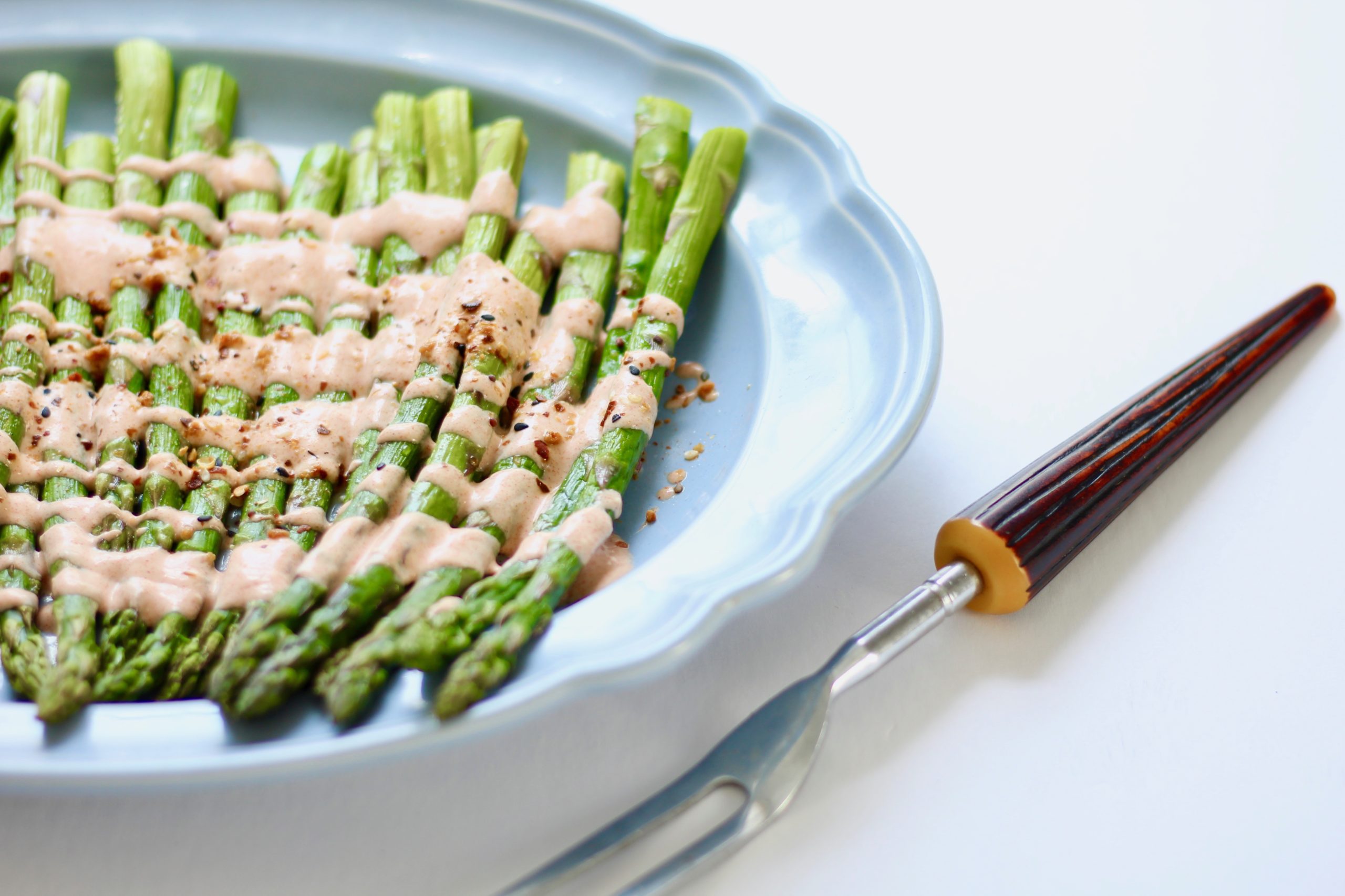 closeup of asparagus with smoky yogurt