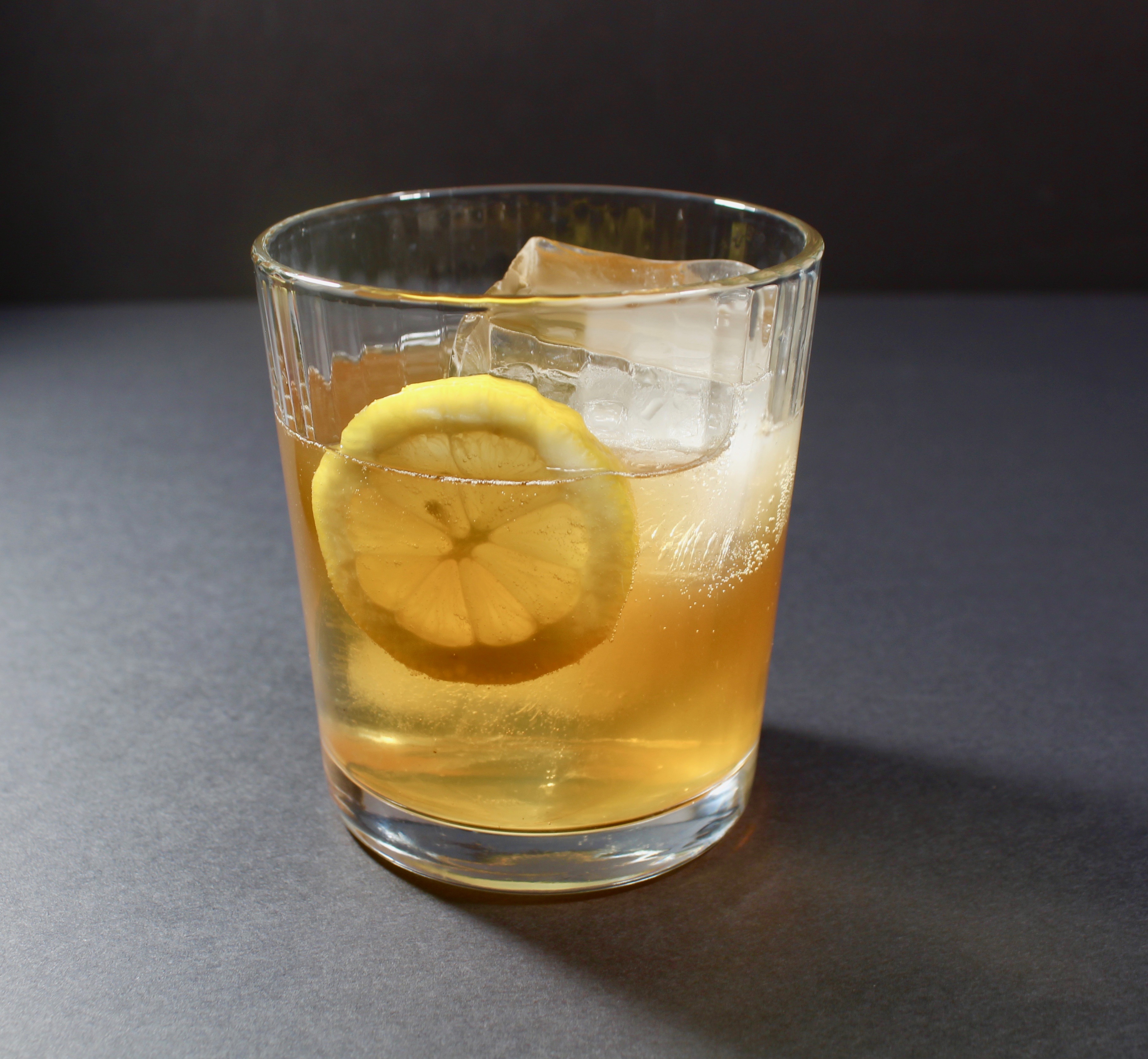 apple ginger cocktail with lemon garnish