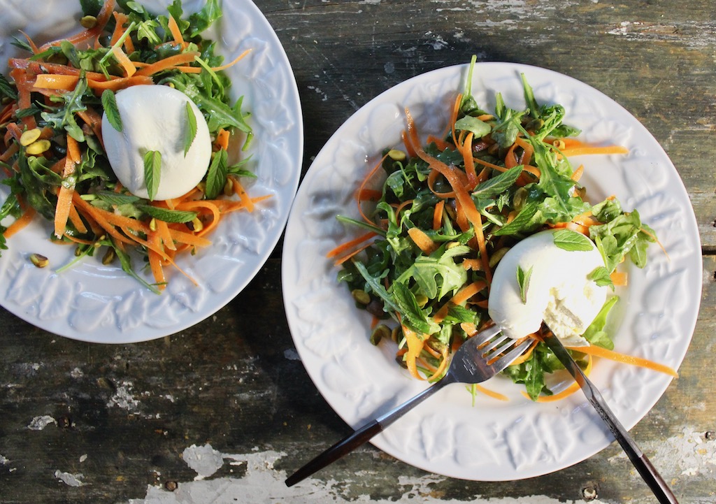 two plates carrot arugula burrata salad