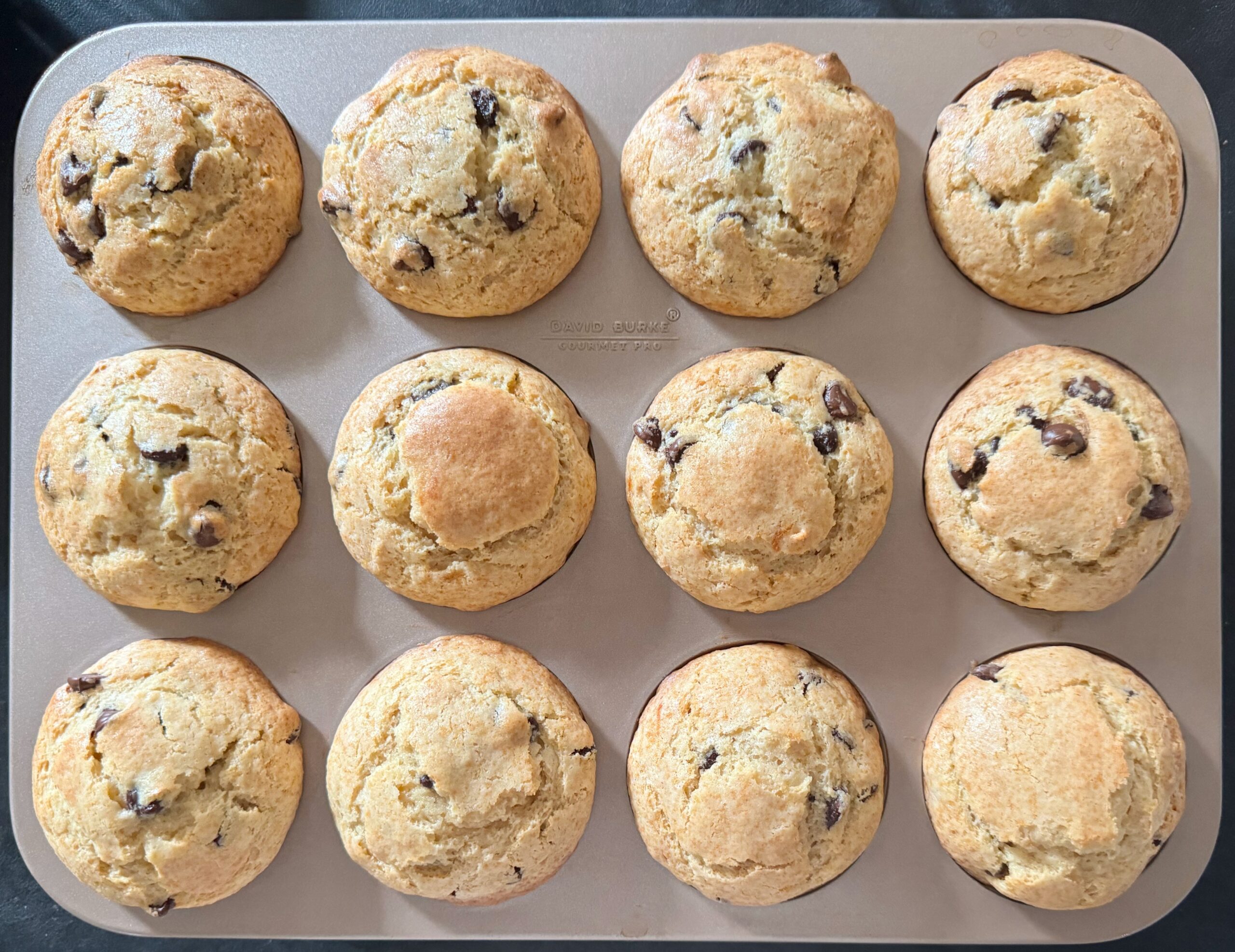tin of baked sour cream chocolate chip muffins