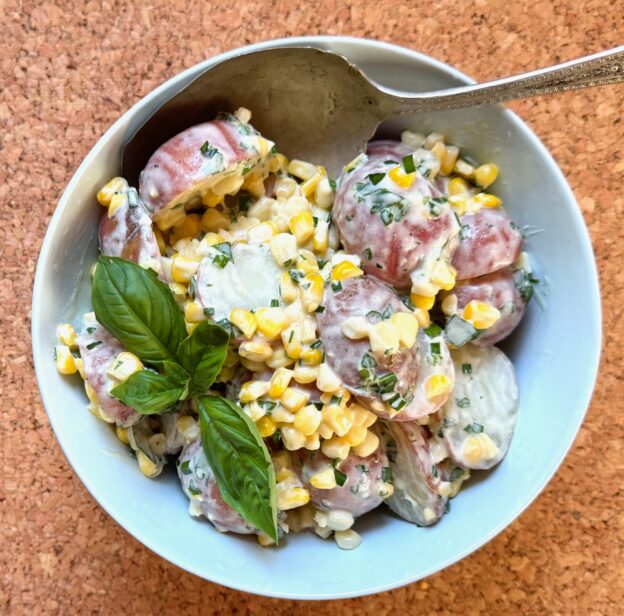 bowl of herbed corn potato salad